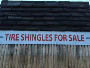 closeup of tire shingles with sale sign