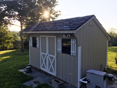 Shed with rubber tire shingles